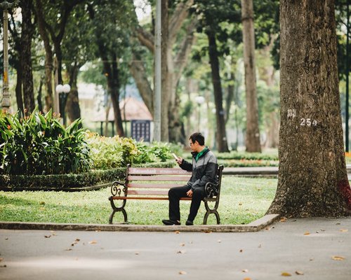 Person relaxing in a city park without devices